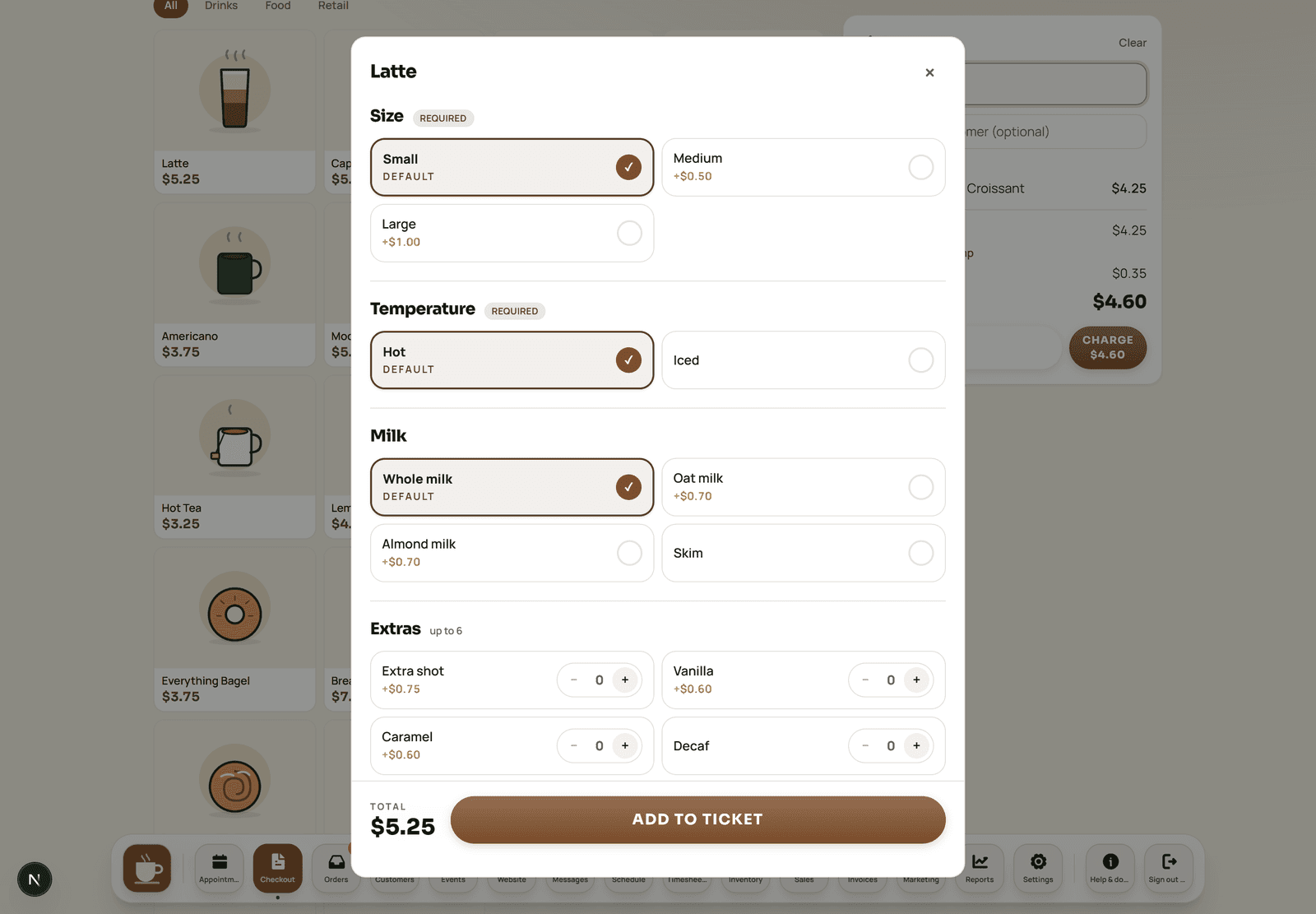 The counter-service register for a café with photo product tiles and a named order.